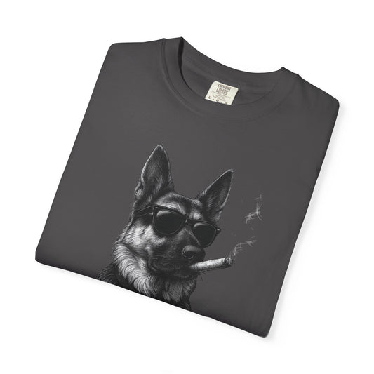 Folded graphite t-shirt with a graphic of a dog wearing sunglasses and smoking a cigarette on a white background.