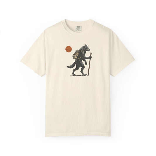 Hiking Wolf graphic t-shirt in Ivory — werewolf with backpack and walking stick print on garment-dyed heavyweight cotton tee.