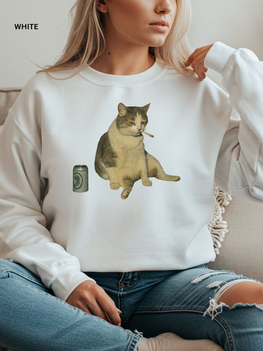 Person wearing a white sweatshirt with a cat graphic and camera pocket design.