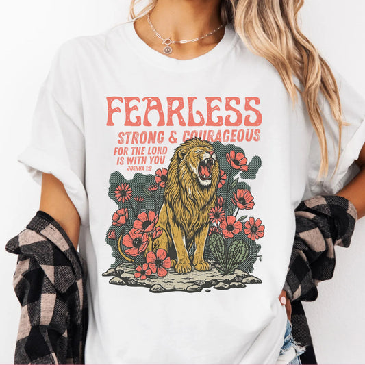 White t-shirt with a lion graphic and text 'Fearless Strong & Courageous' on a white background