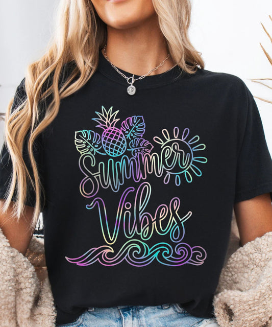 Person wearing a black t-shirt with 'Summer Vibes' colorful design.