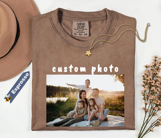 espresso sweatshirt with a family photo print and 'custom photo' text, next to a hat and dried flowers.