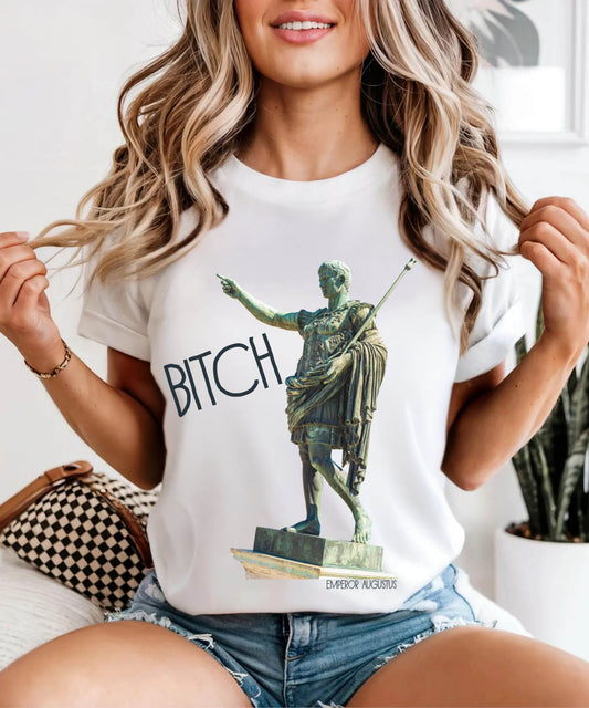 person wearing a white t-shirt with a graphic of a statue pointing and the word 'Bitch' on a white background