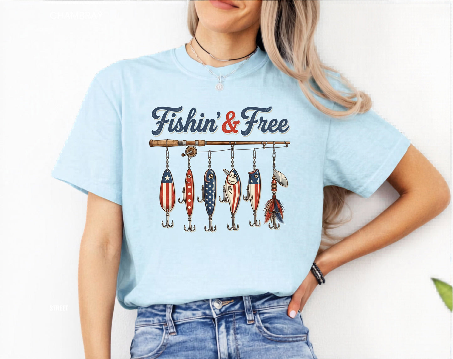 Chambray t-shirt with 'Fishing & Free' graphic worn by a person on a white background