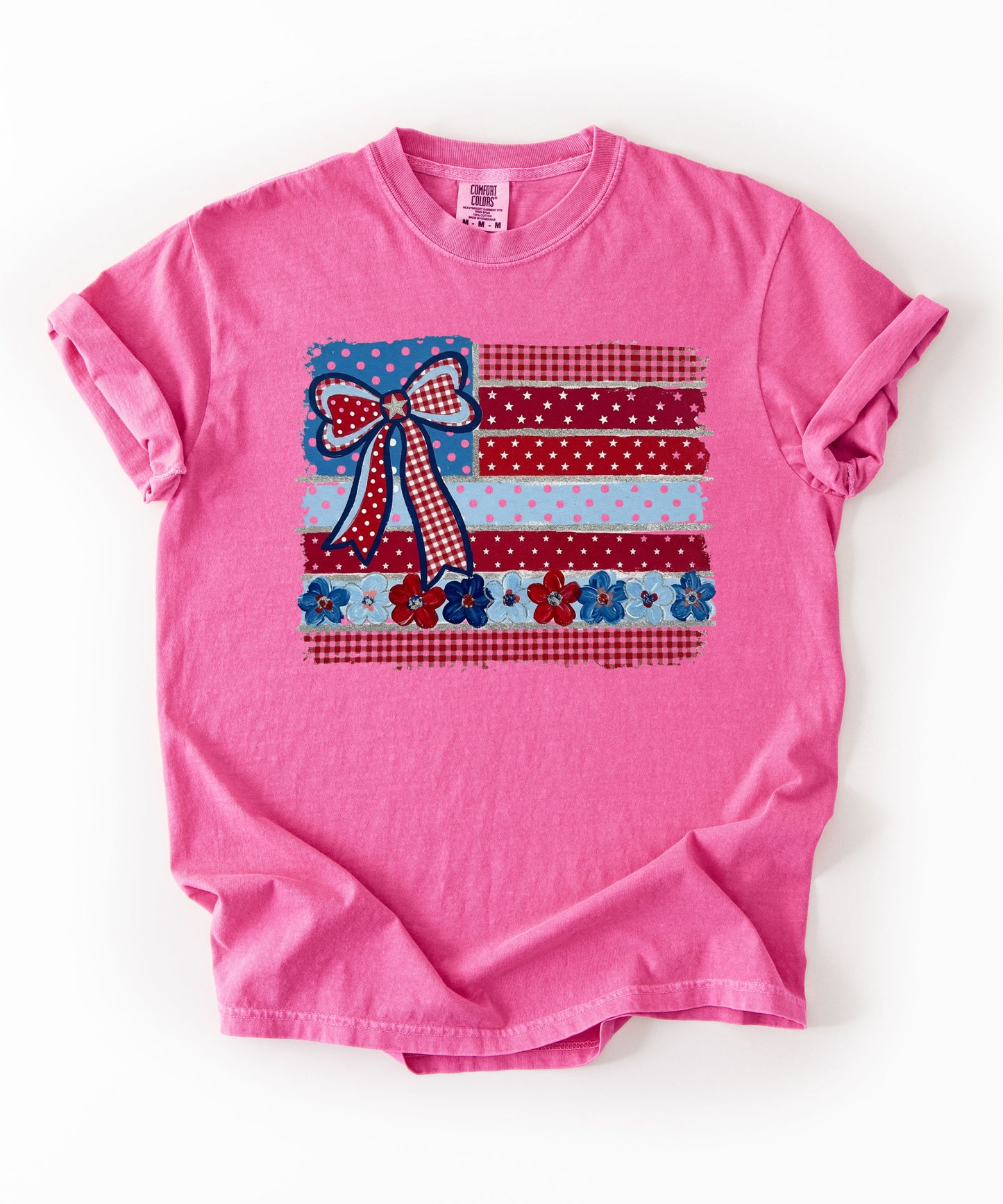 Crunchberry garment-dyed t-shirt with Americana patchwork flag bow graphic in red, white and blue