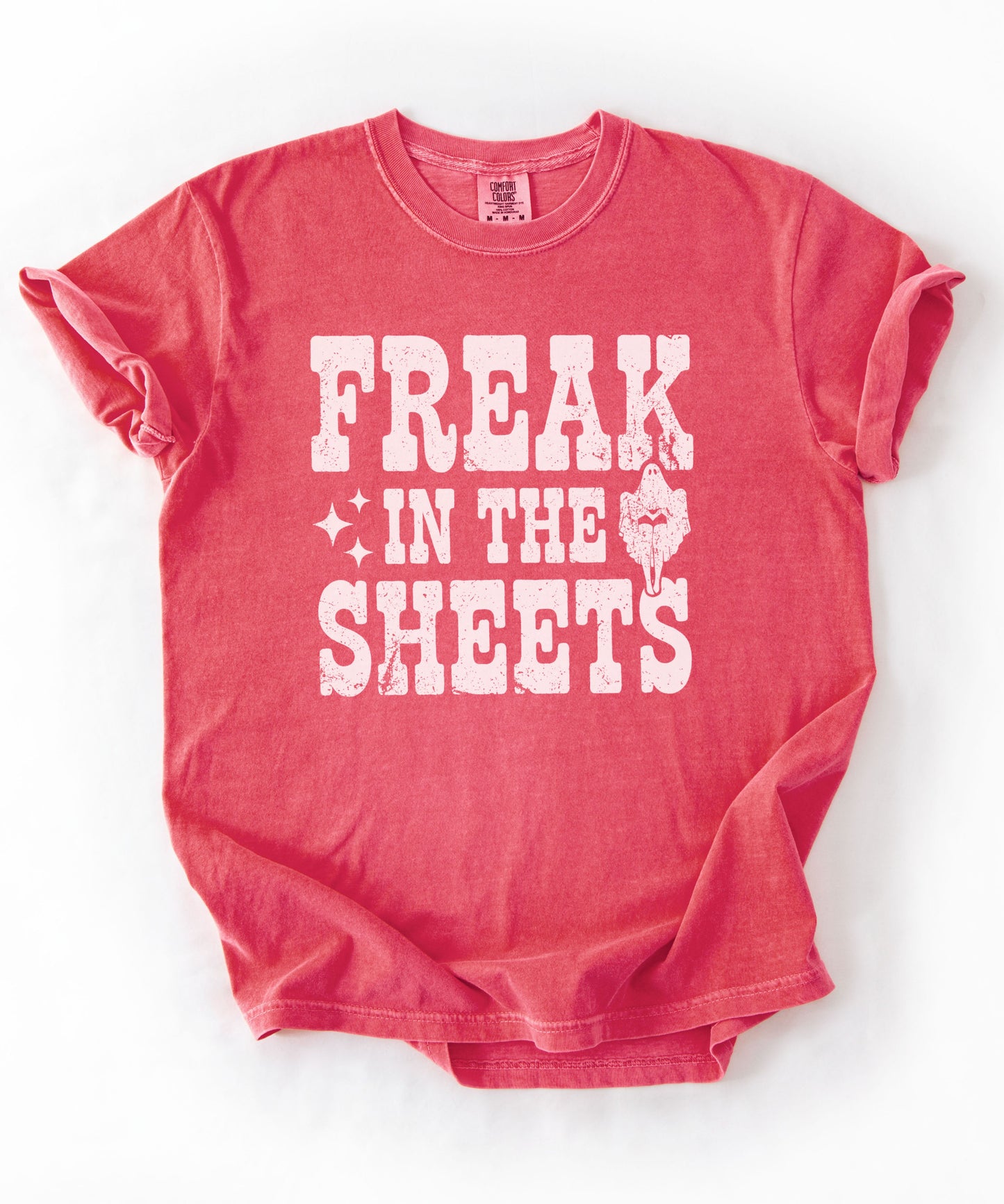 Crunchberry Comfort Colors Freak in the Sheets funny Halloween ghost graphic tee — distressed western lettering with ghost and sparkle accents, flat lay