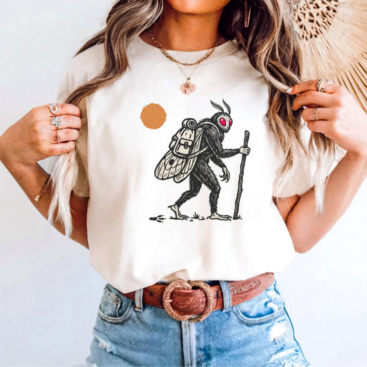 Mothman Traveler Graphic T-Shirt in Ivory — backpacking cryptid tee with sun