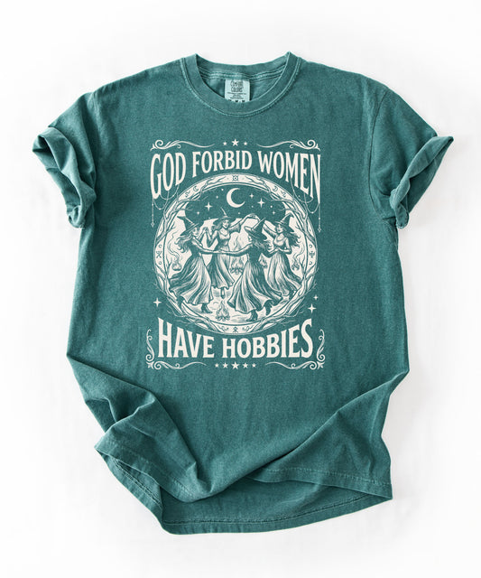 God Forbid Women Have Hobbies graphic t-shirt in Blue Spruce — vintage witch circular print on garment-dyed heavyweight cotton tee.