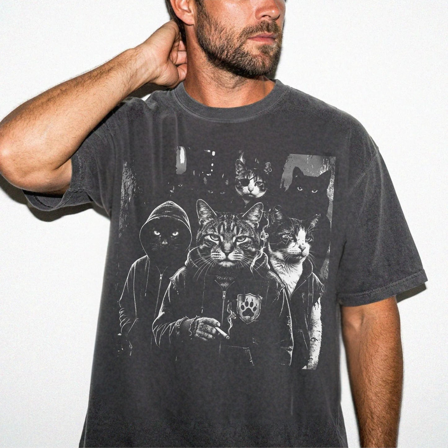 Man wearing garment-dyed pepper Cat Gang graphic tee with moody cat mob streetwear print — oversized relaxed fit