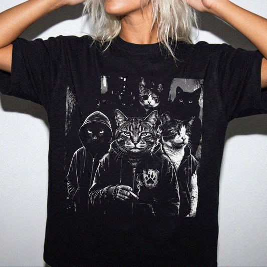 Woman wearing garment-dyed Black Cat Gang graphic tee with moody cat mob streetwear print — oversized relaxed fit