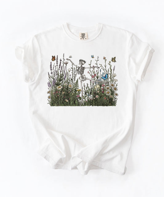 Dancing skeleton wildflower botanical graphic on White Comfort Colors garment-dyed t-shirt