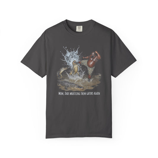 graphite t-shirt with graphic design of one person wrestling alligators and text "mom, dad wrastling them gators again"