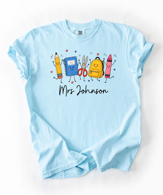 Personalized teacher t-shirt in Chambray with custom name printed on front — soft garment-dyed cotton tee, sizes S–4XL