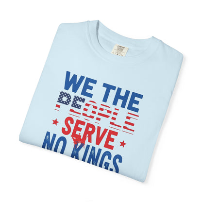 Folded light blue t-shirt with 'We the People Serve No Kings' text on a white background
