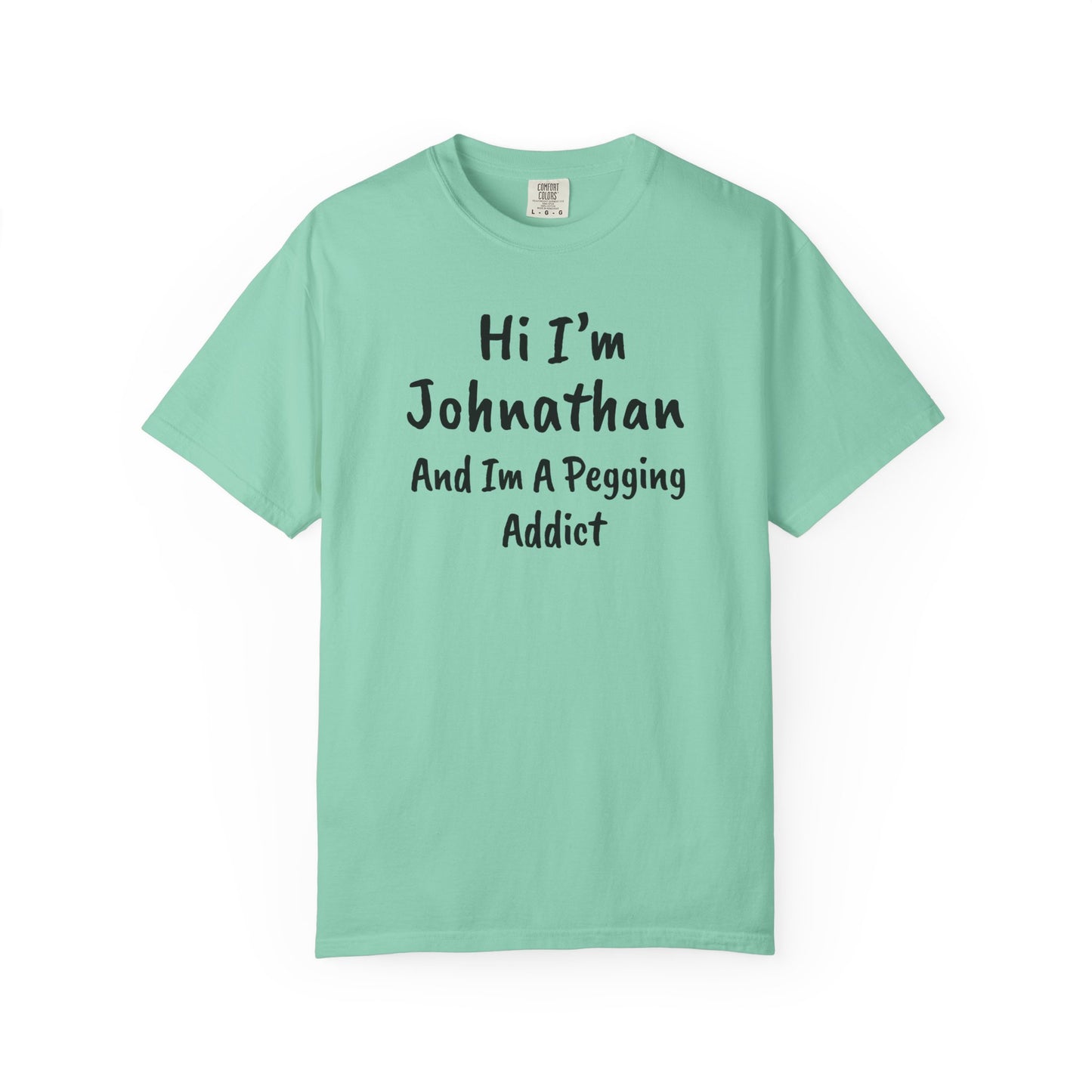 Chalky Mint garment-dyed heavyweight t-shirt with personalized 'Hi I'm [Name] And I'm A Pegging Addict' graphic in handwritten-style font, centered on chest