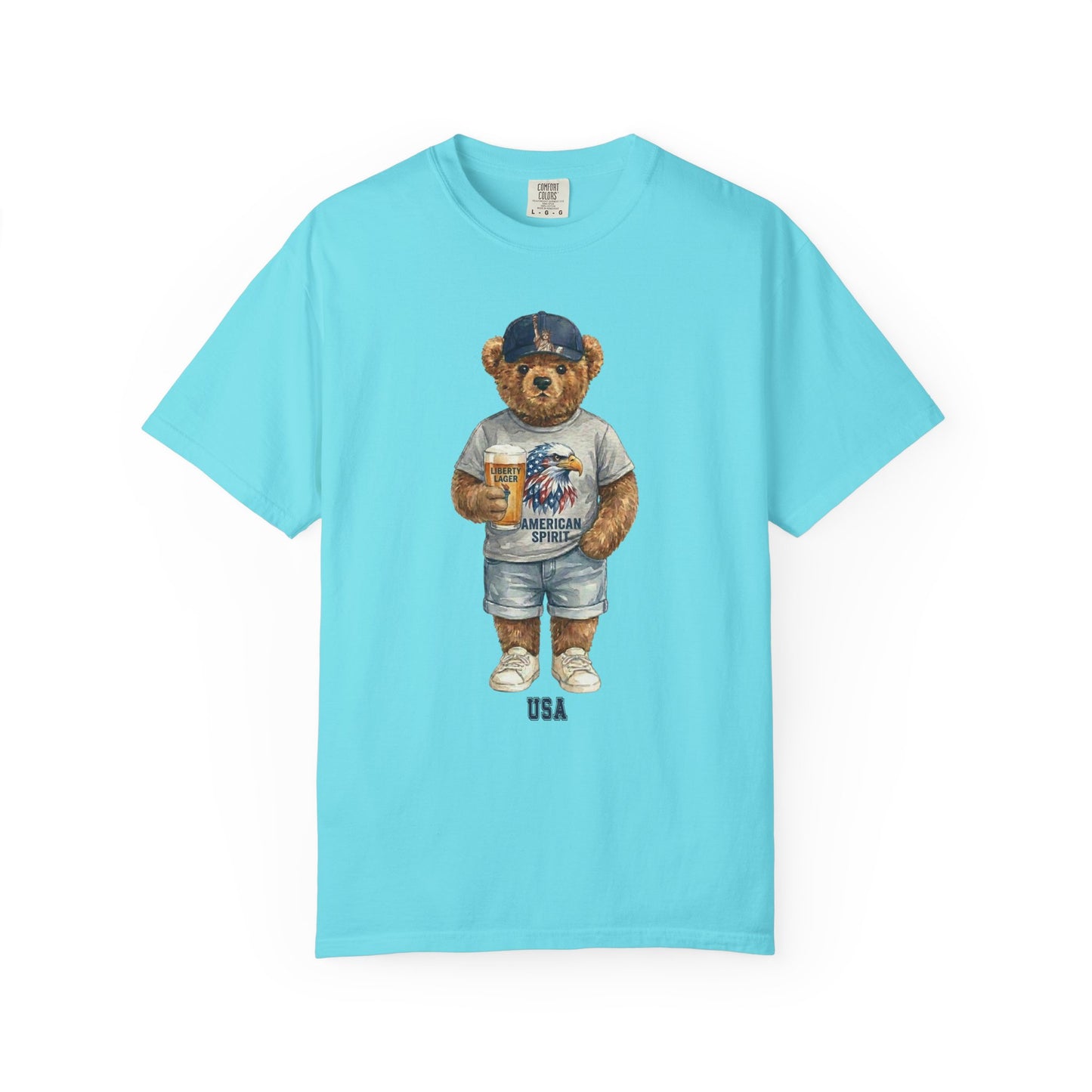 Lagoon blue t-shirt with a bear graphic wearing an American flag shirt and cap on a white background