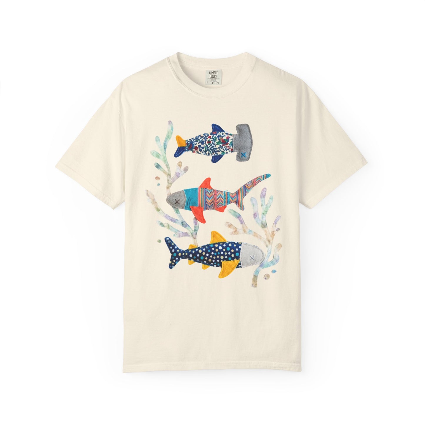 Faux patterned sharks graphic tee in Ivory showing the hand-painted shark illustration with tidepool textures — color mockup