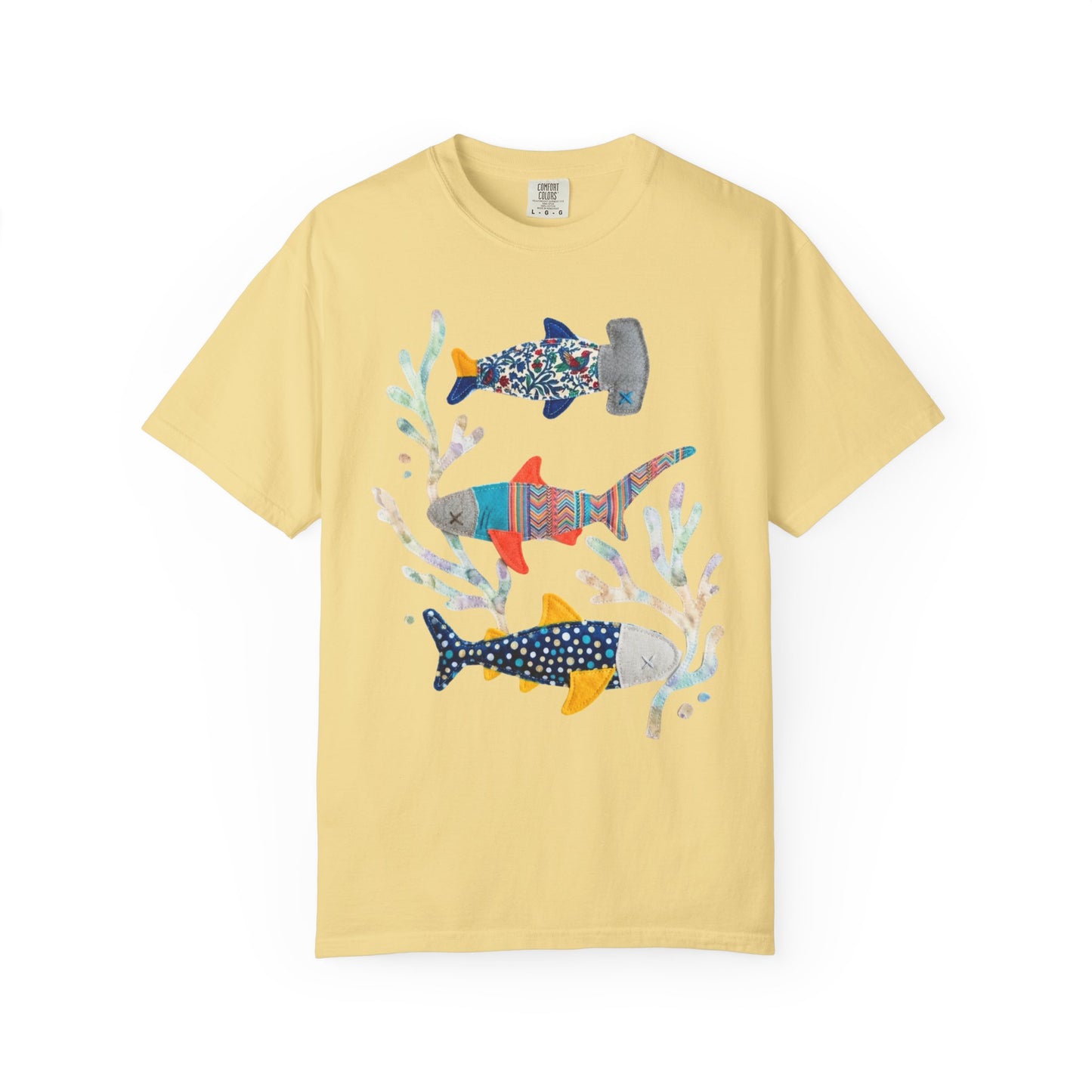 Faux patterned sharks graphic tee in Butter showing the hand-painted shark illustration with tidepool textures — color mockup