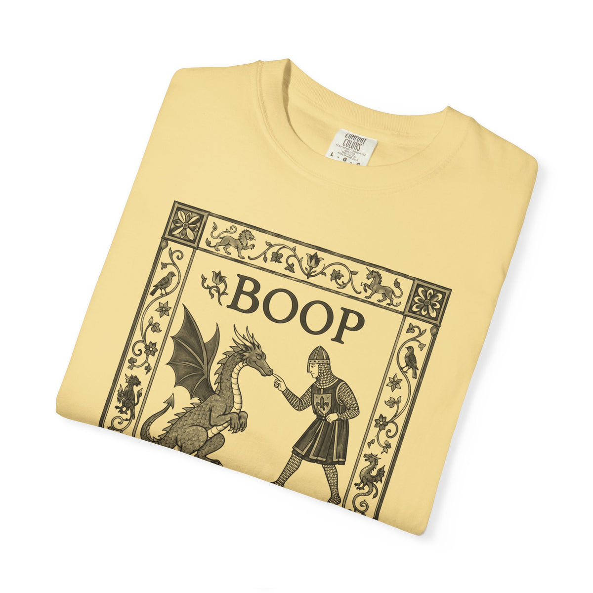 Boop Dragon T-Shirt in Butter — vintage illustration tee featuring an armored knight and winged dragon with ornate border and "BOOP" lettering

