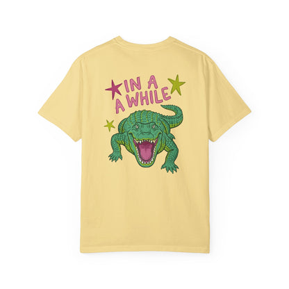butter t-shirts with alligator graphics on front "later gator" and the text on back i"n a while crocodile"a plain background