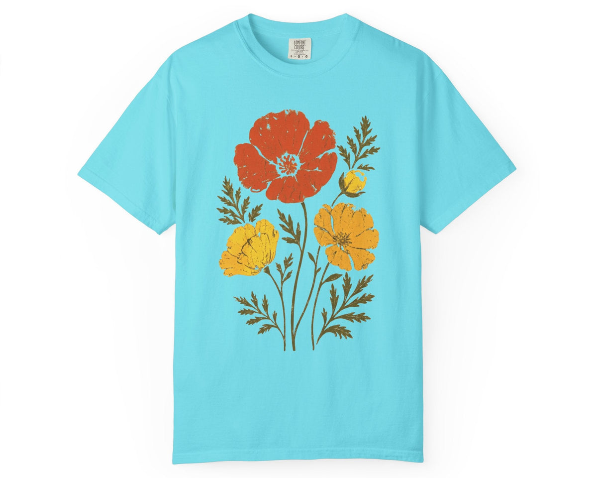 A Lagoon Blue short-sleeve crewneck t-shirt featuring a stylized graphic of red, yellow, and orange poppy flowers with green stems on the front, displayed against a solid white background.