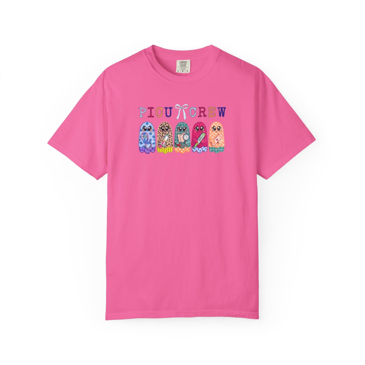Neon Pink Comfort Colors PICU Crew t-shirt with five colorful patterned ghosts holding nursing tools — pediatric ICU nurse graphic tee, flat lay