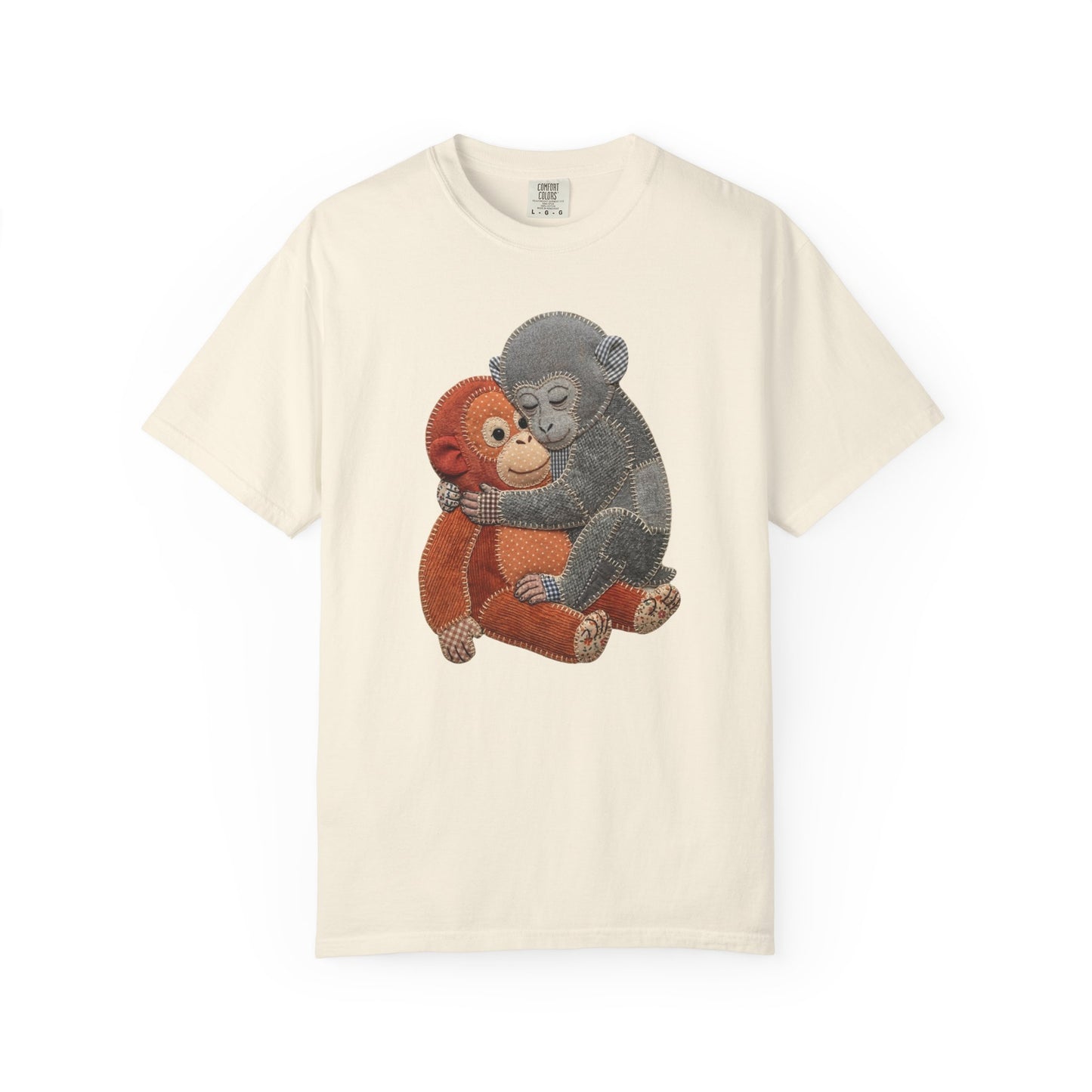 T-shirt with a graphic of two monkeys hugging on a beige background