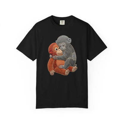 Black t-shirt with two cartoon monkeys hugging on a white background