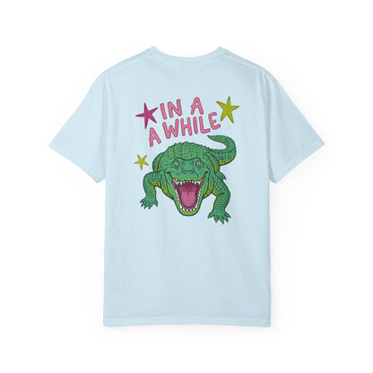 chambray t-shirts with alligator graphics on front "later gator" and the text on back i"n a while crocodile"a plain background