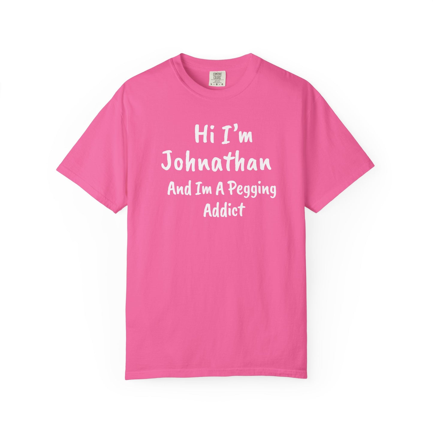 Neon Pink garment-dyed heavyweight t-shirt with personalized 'Hi I'm [Name] And I'm A Pegging Addict' graphic in handwritten-style font, centered on chest