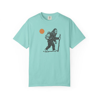 Bigfoot Hiker T-Shirt in Chalky Mint— Sasquatch with backpack sunset graphic tee