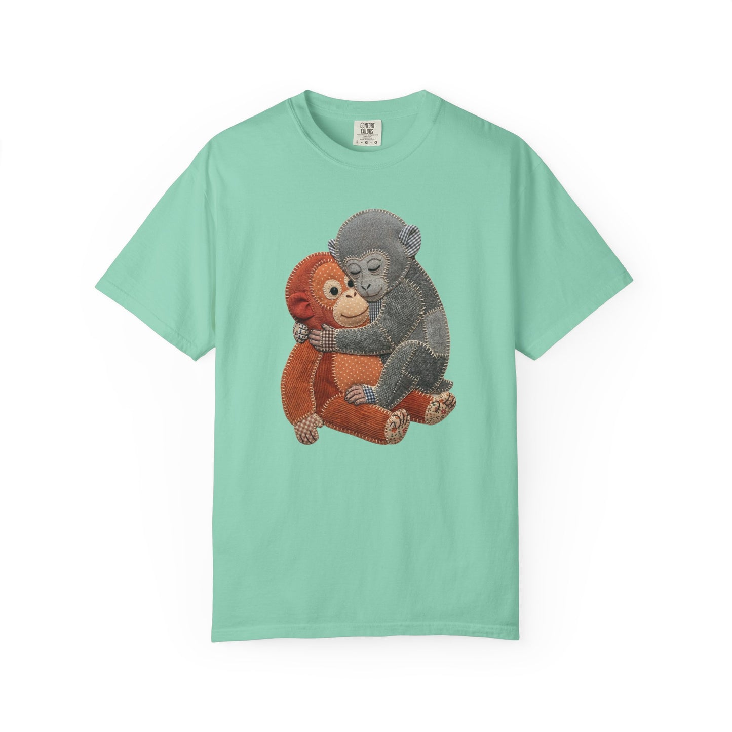 chalky mint t-shirt with a graphic of two monkeys hugging on a white background