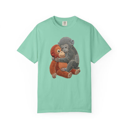 chalky mint t-shirt with a graphic of two monkeys hugging on a white background