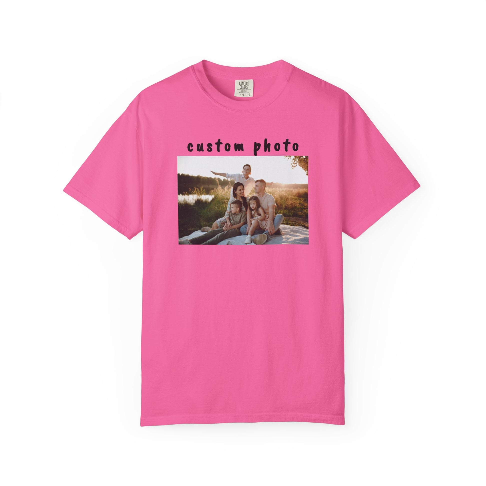 neon Pink t-shirt with a printed photo of a family by a lake on a white background