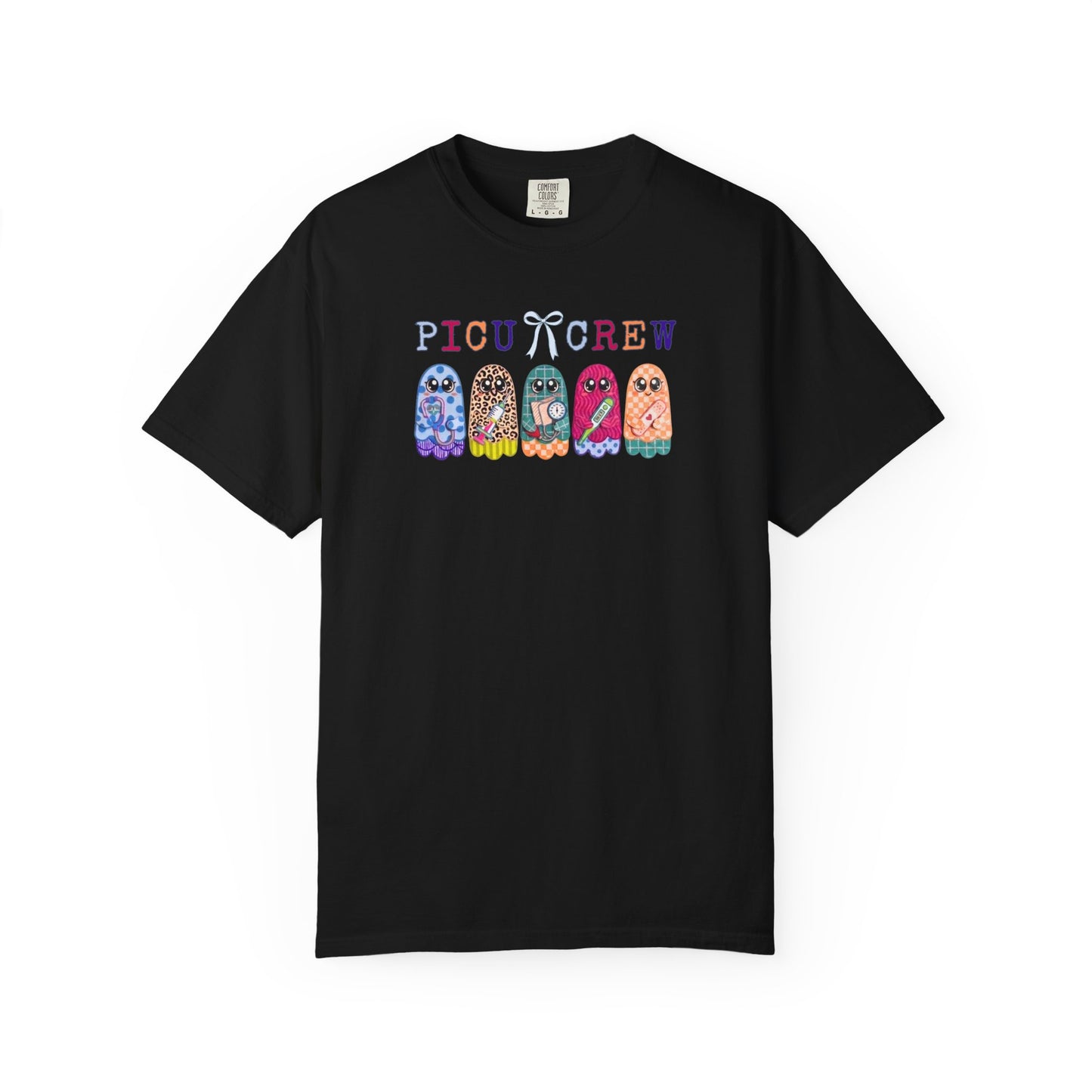Black Comfort Colors PICU Crew t-shirt with five colorful patterned ghosts holding nursing tools — pediatric ICU nurse graphic tee, flat lay
