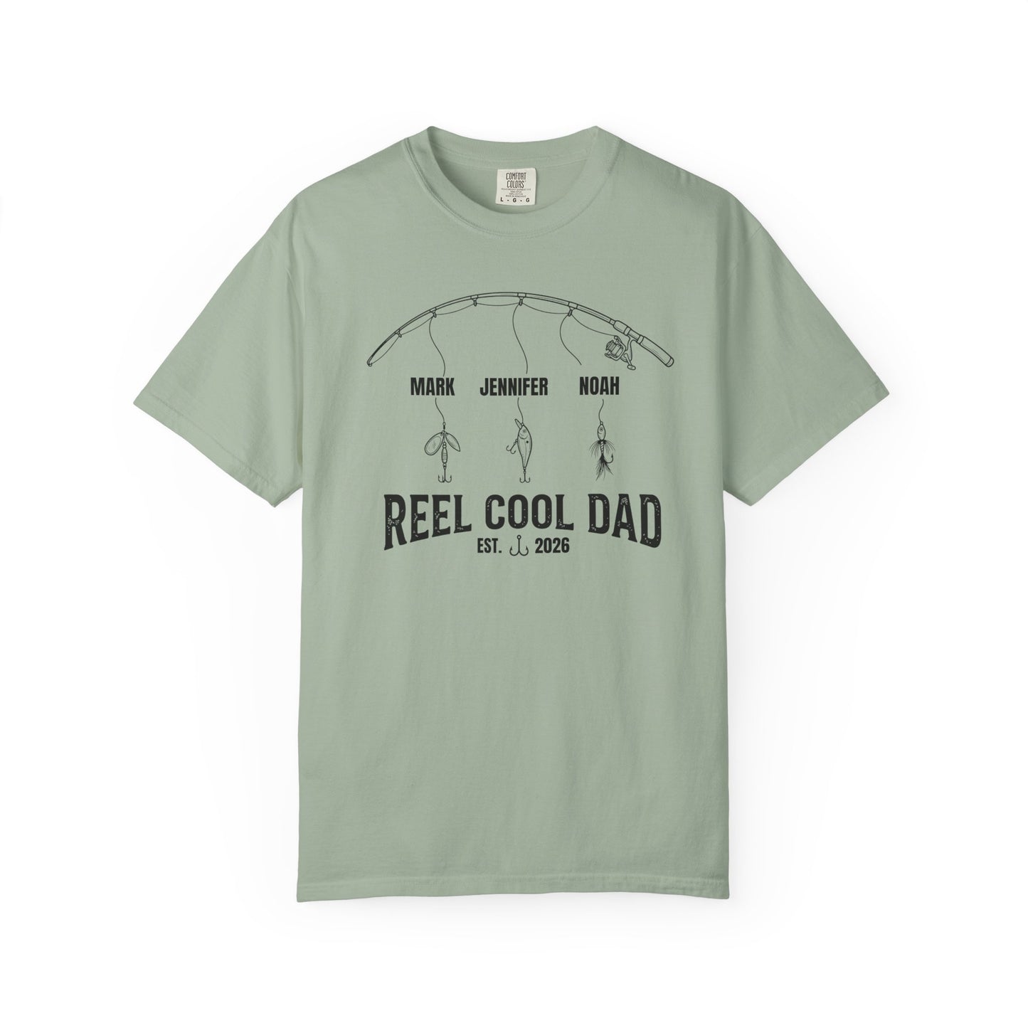 Bay t-shirt with a graphic of a fishing rod and text reel cool dad on a white background