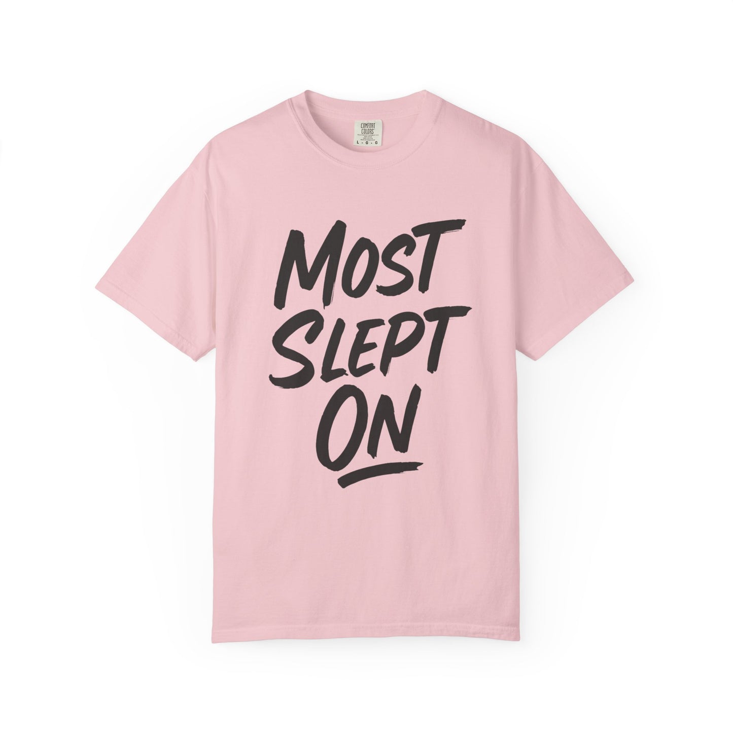 Pink t-shirt with black text 'MOST SLEPT ON' on a white background