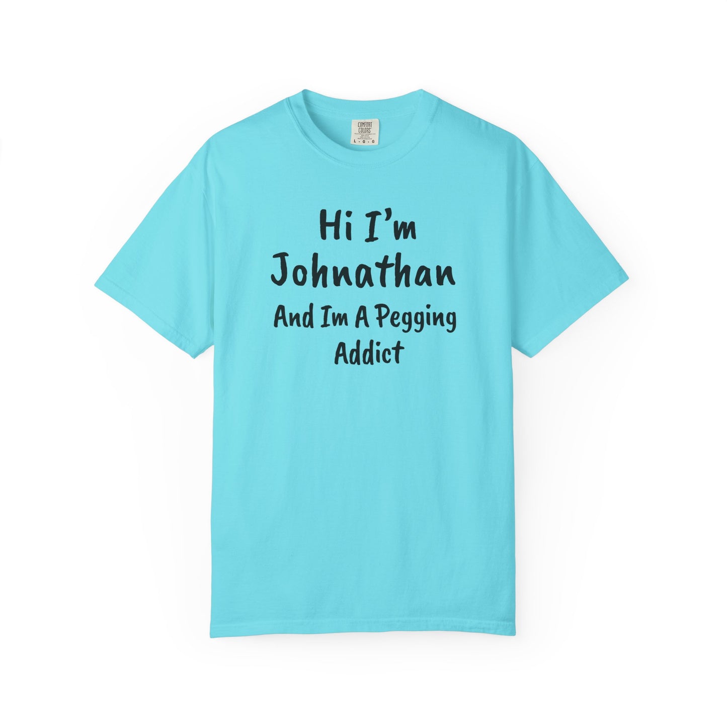 Lagoon Blue garment-dyed heavyweight t-shirt with personalized 'Hi I'm [Name] And I'm A Pegging Addict' graphic in handwritten-style font, centered on chest