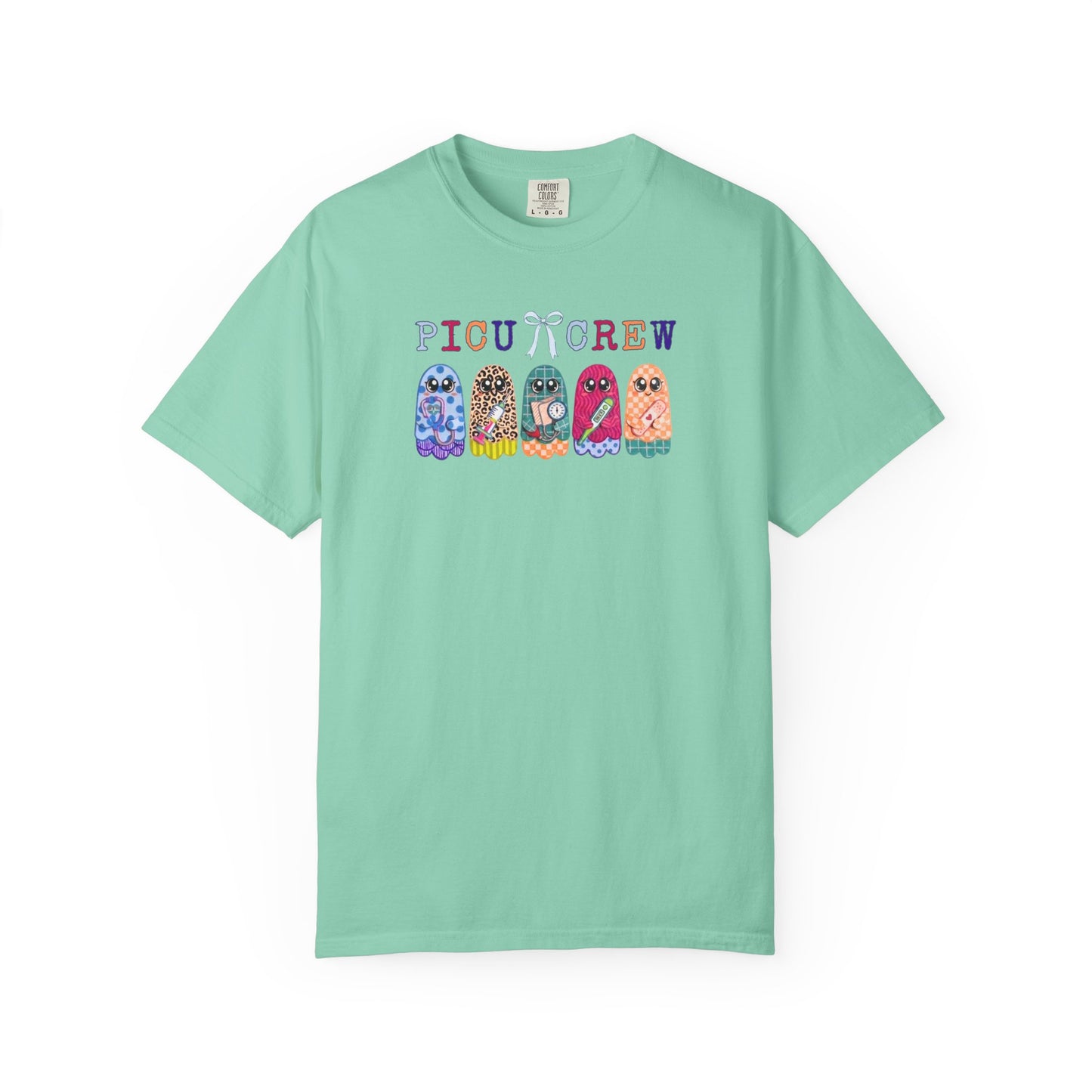 Island Reef Comfort Colors PICU Crew t-shirt with five colorful patterned ghosts holding nursing tools — pediatric ICU nurse graphic tee, flat lay