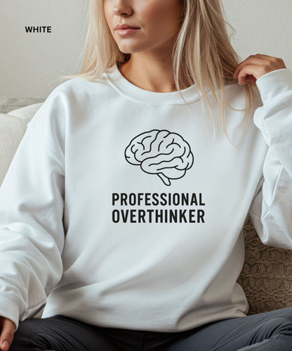 Person wearing a white sweatshirt with a brain graphic and text 'PROFESSIONAL OVERTHINKER'.