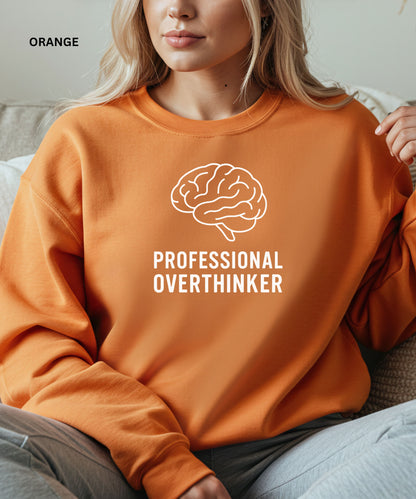 Person wearing an orange sweatshirt with a brain graphic and text 'Professional Overthinker'.