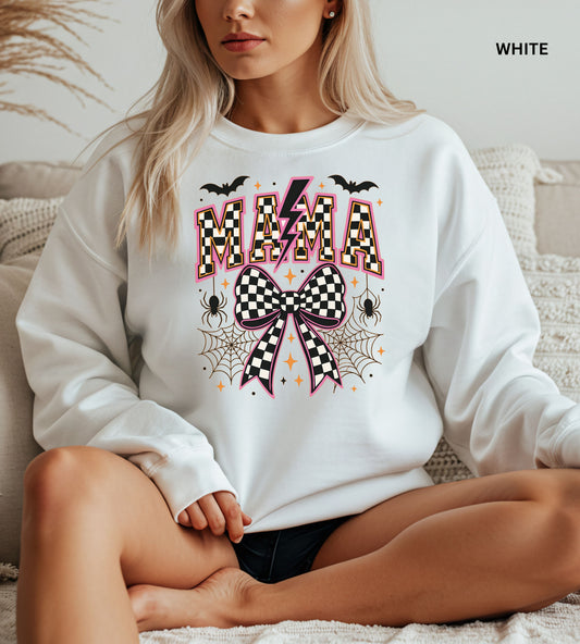 White sweatshirt with Halloween-themed design featuring the word 'MAMA' and decorative elements.