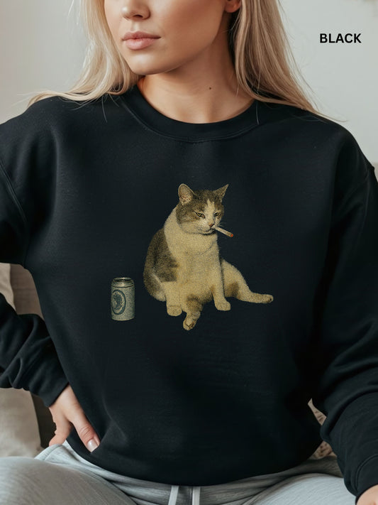 Person wearing a black sweatshirt with a cat and beer can graphic