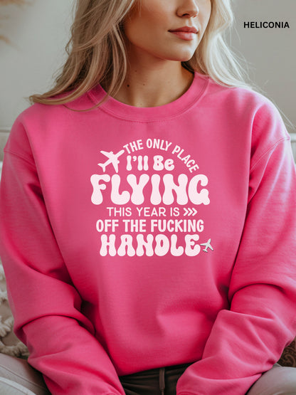 Person wearing a heliconia sweatshirt with a humorous text design that says "the only place ill be flying is off the fucking handle, sitting on a couch.
