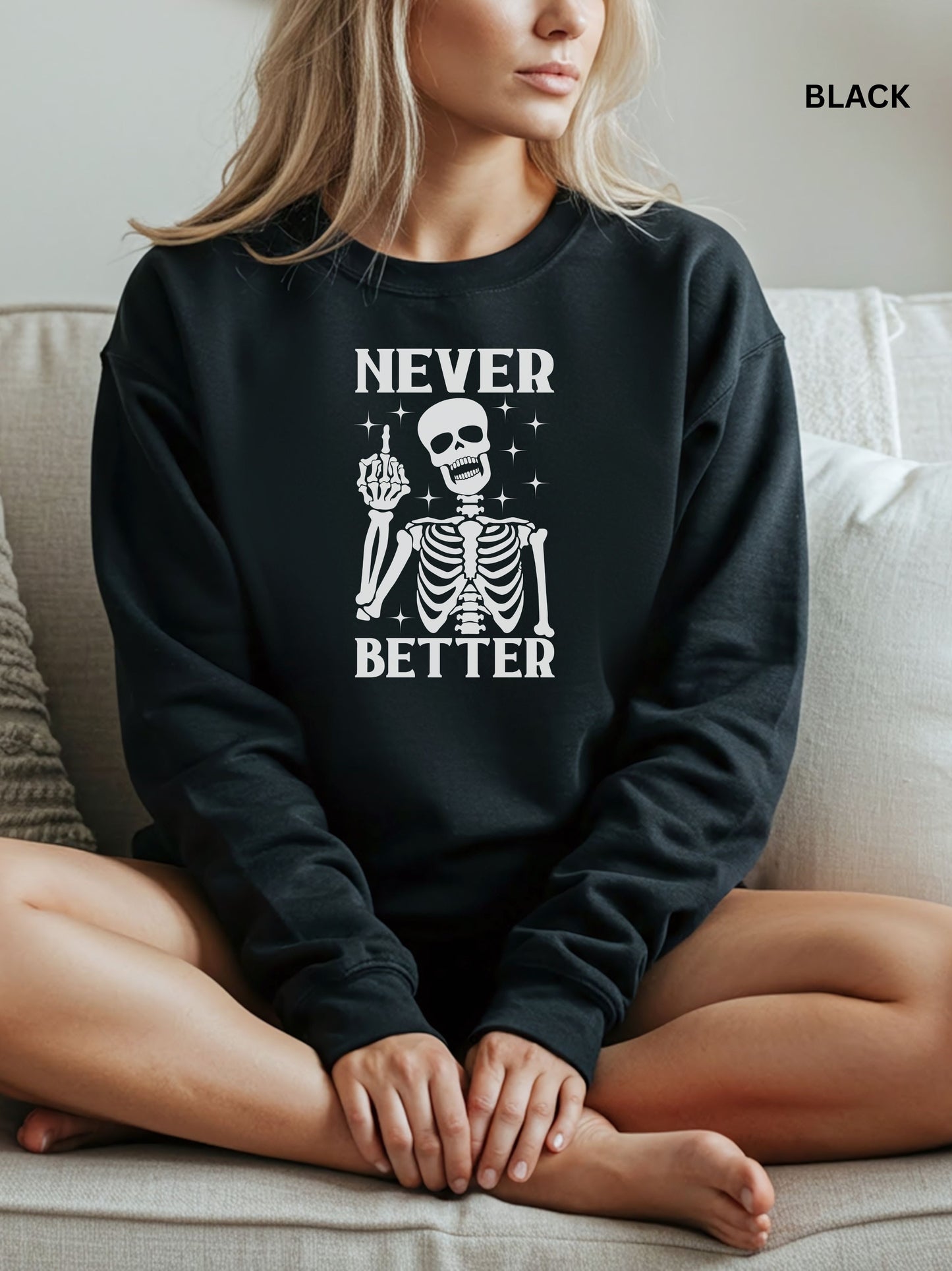 Person wearing a black sweatshirt with a skeleton graphic and text that says "never better"