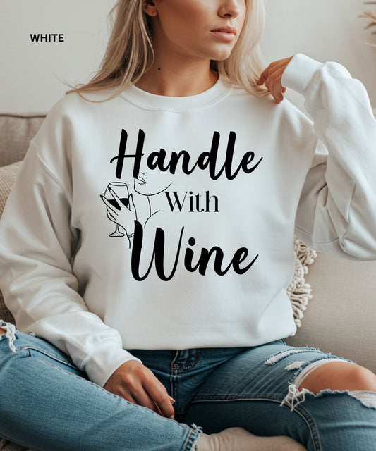 White sweatshirt with 'Handle With Wine' text and graphic, worn by a person.