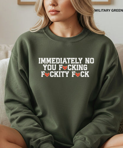 Person wearing a green sweatshirt with offensive language text