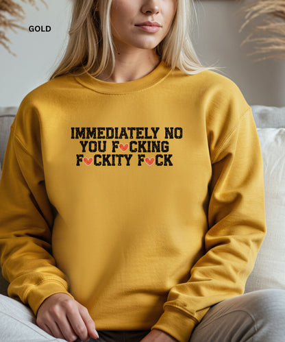 Person wearing a mustard yellow sweatshirt with graphic text design.