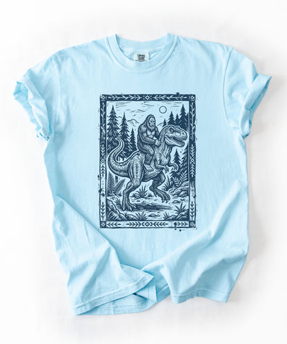 Bigfoot Riding T‑Rex Comfort Colors T‑Shirt