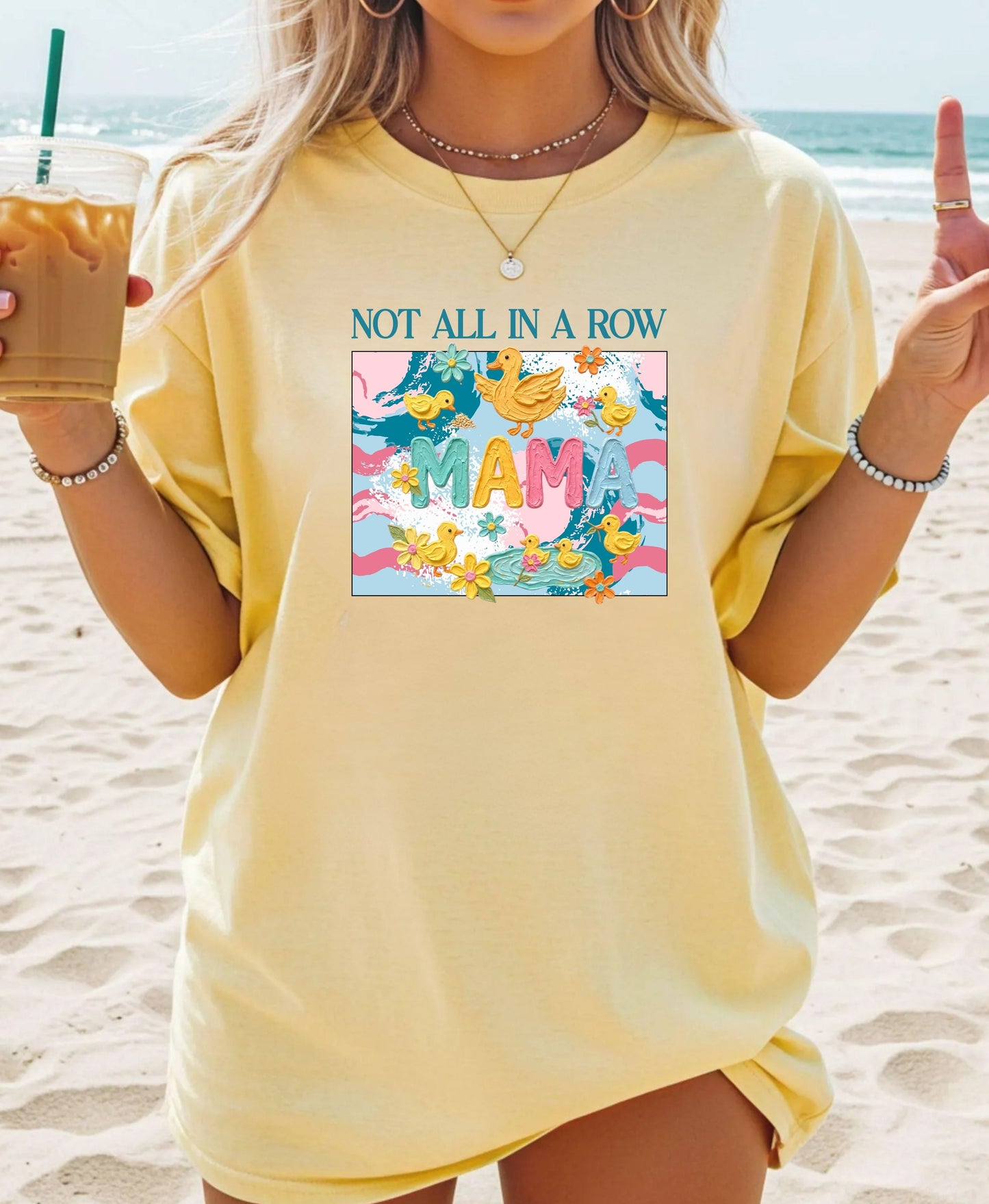 butter "mama" t-shirt with colorful graphic design featuring ducks and text on a white background.